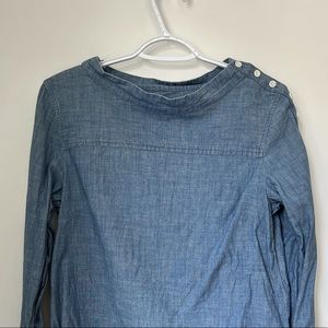 Cotton denim long sleeve top by J. Crew. Waste is shorter in front. Size 2.
